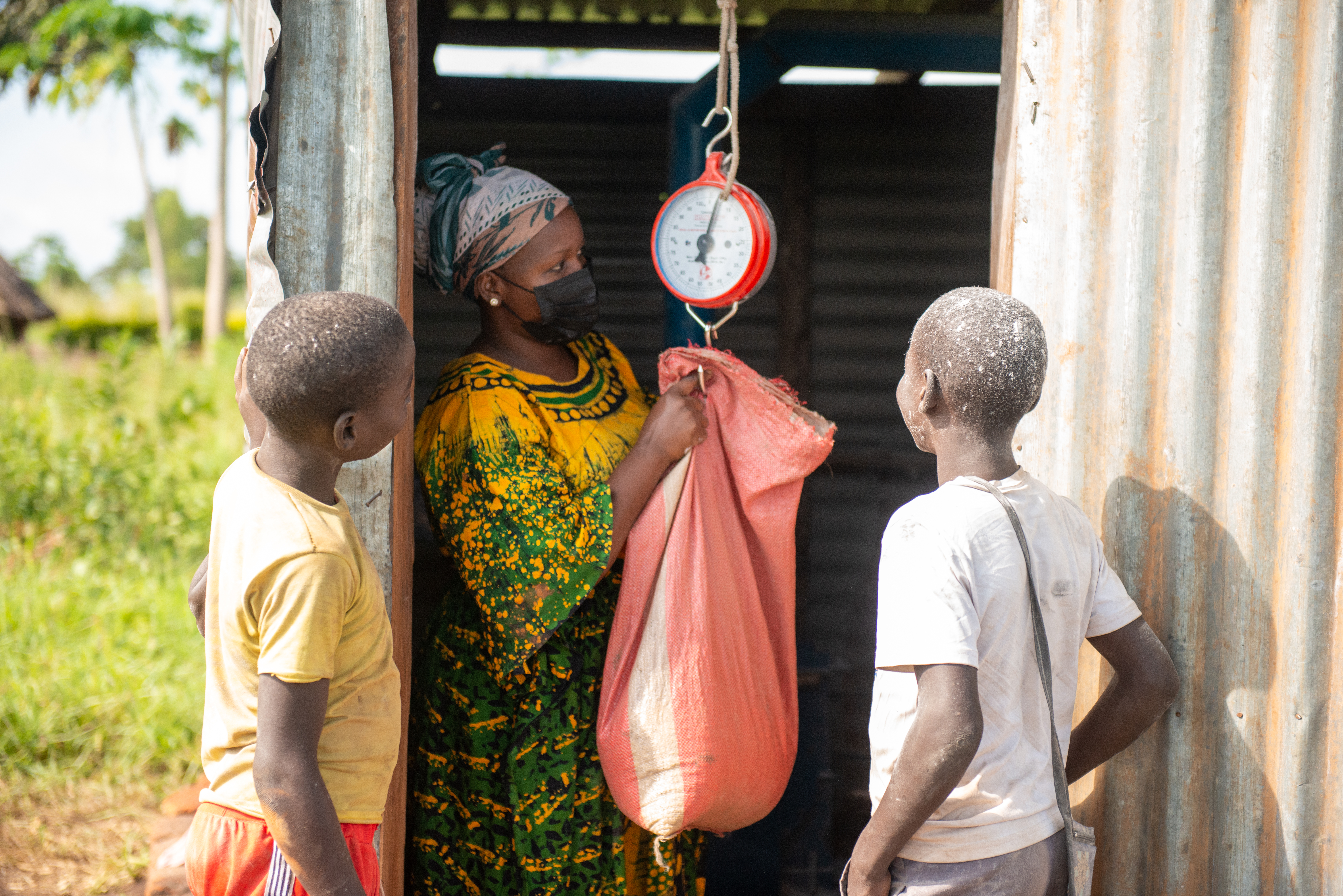 Weighing produce at a rural trading point — Cycle Connect customer